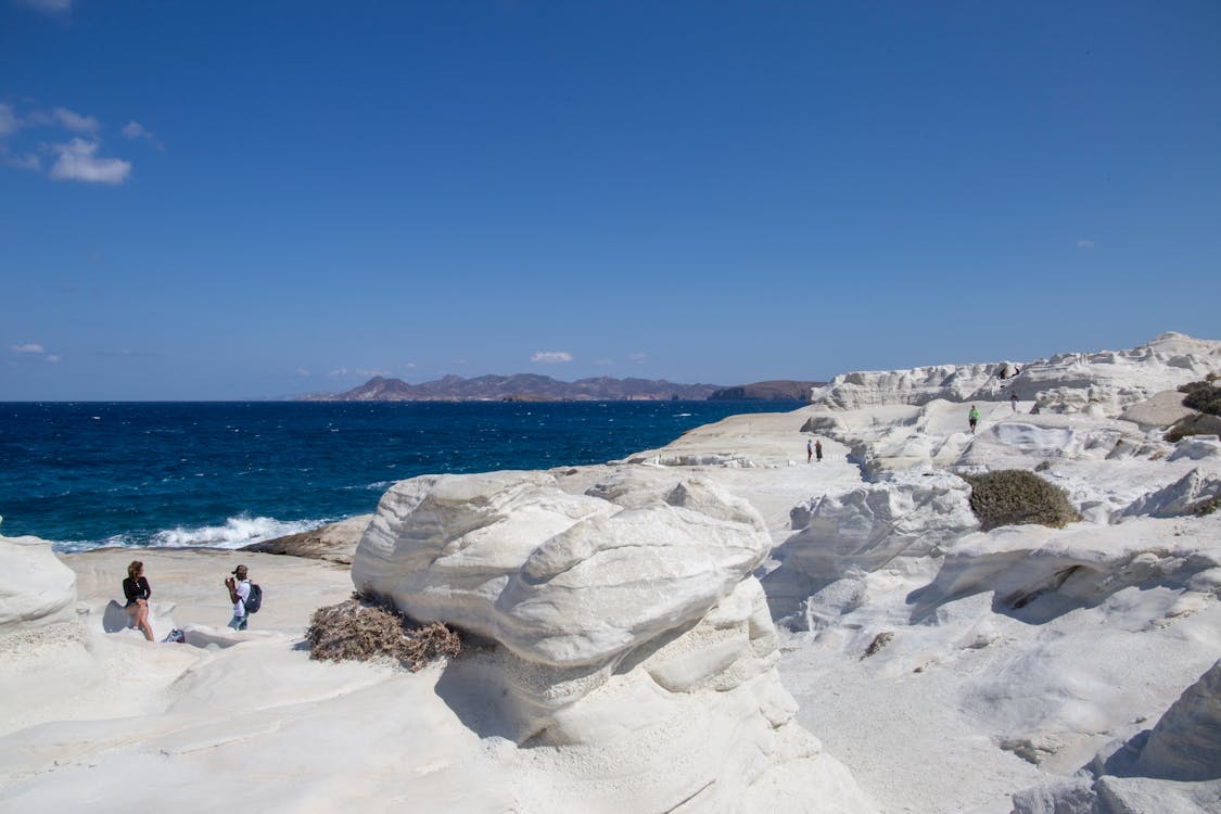 Clear Sky over White Rocks on Shore