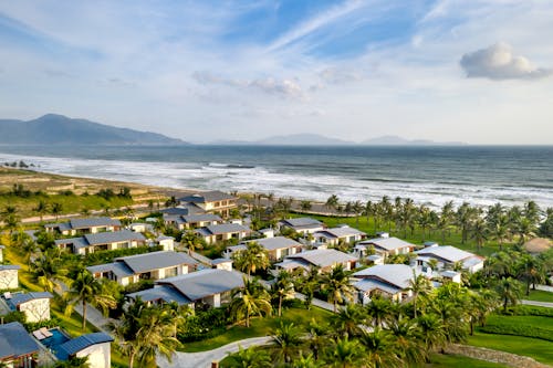 Aerial Footage of Villas on a Resort by the Beach 