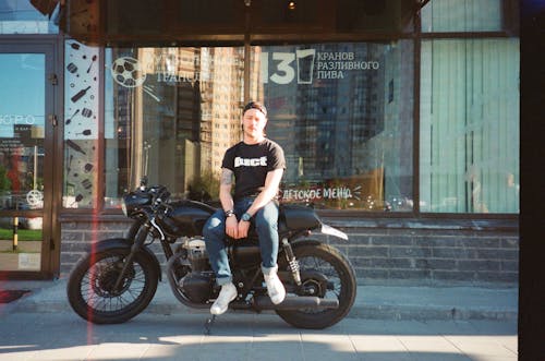 Man Sitting On Motorcycle