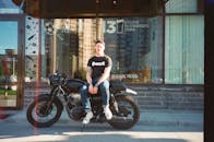 Man Sitting On Motorcycle