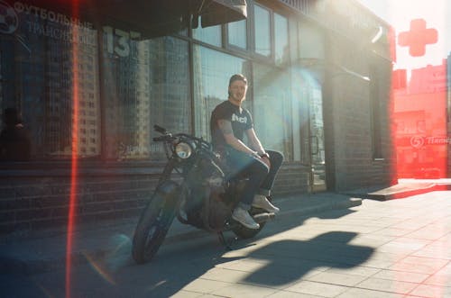 Man Sitting on Black Motorcycle