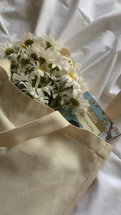 Tote Bag with Daisy Flowers and Book on White Fabric