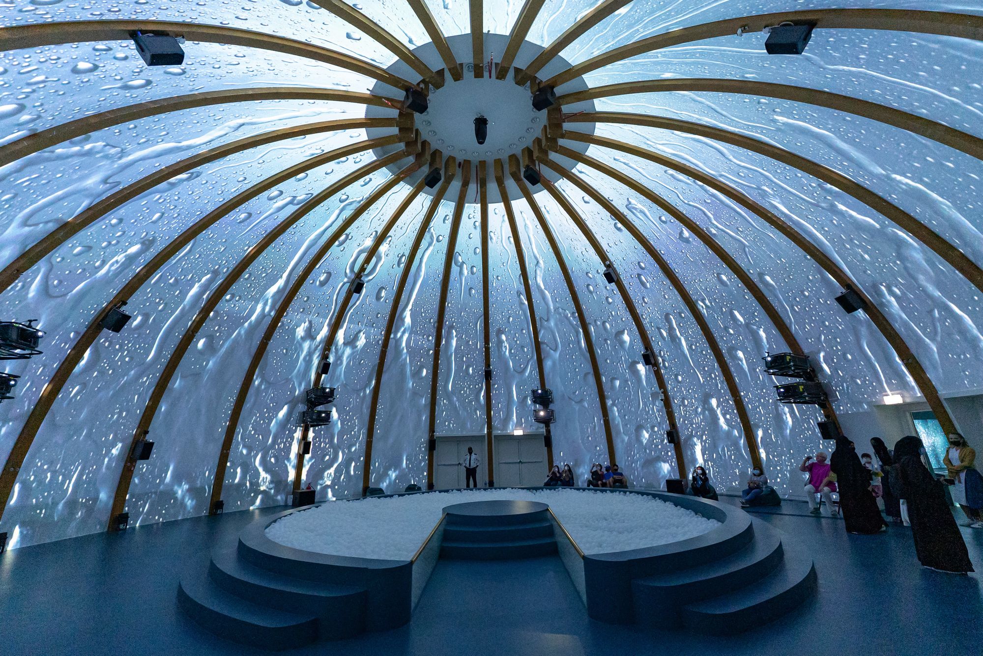 Stunning dome interior with projected water visuals at Dubai Expo Pavilion.