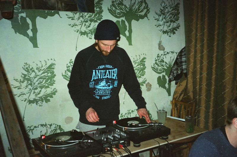 DJ mixing vinyl records on turntables