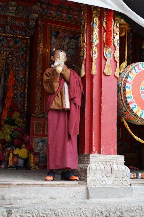 Adolescent in Monk Attire 