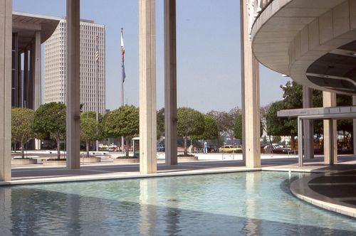 Free Contemporary cityscape featuring modern architecture and water reflections. Stock Photo