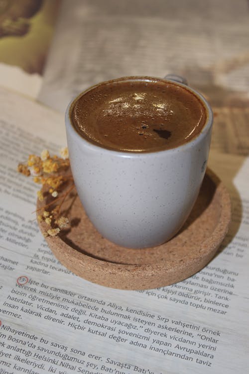 White Ceramic Cup with Chocolate Froth on Top 