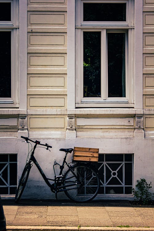 Bicycle Parked near the Window