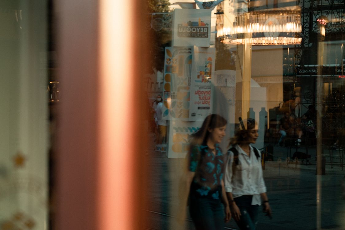 Reflection of People on Glass · Free Stock Photo