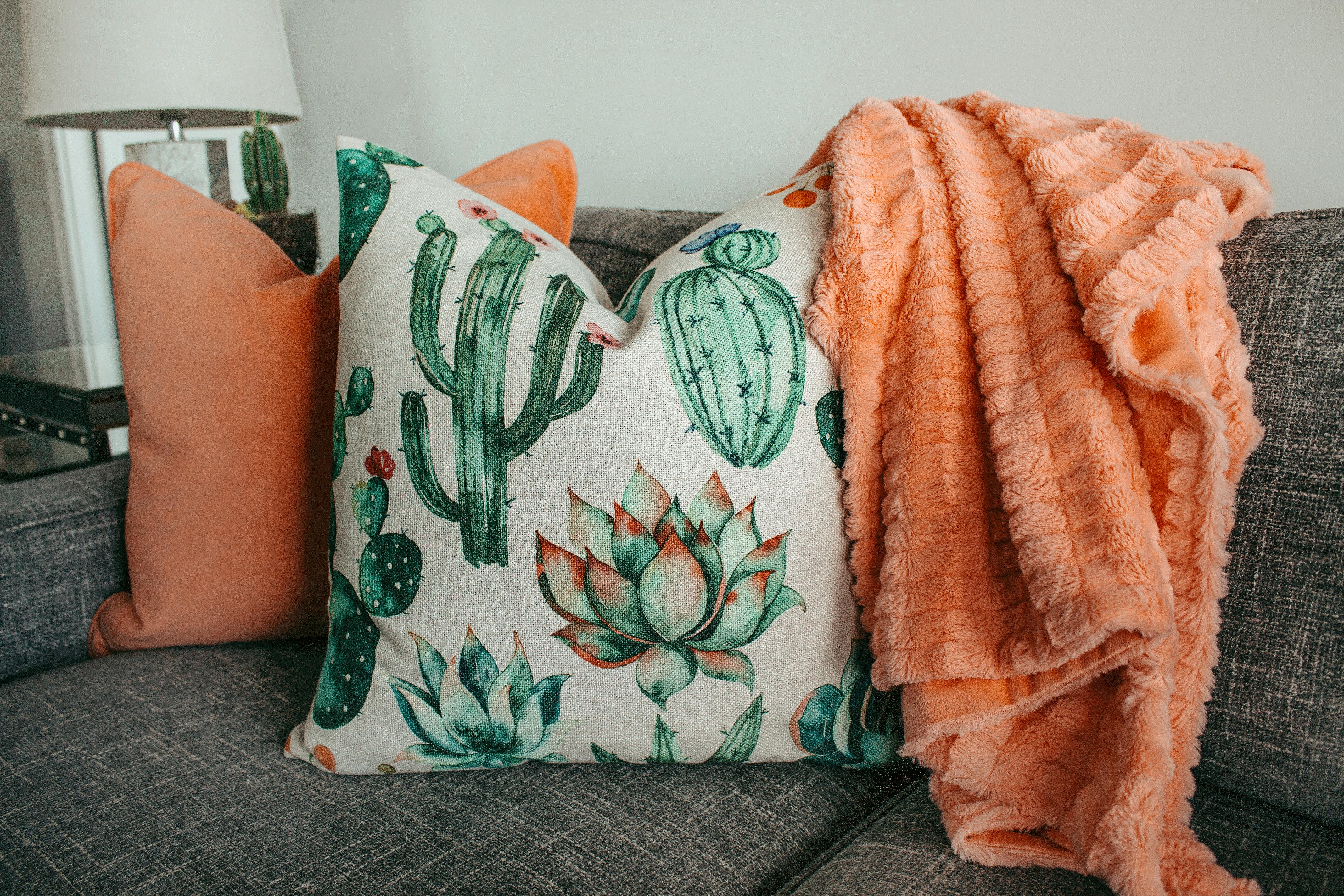 two pillows on gray couch