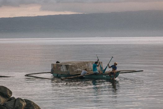 2 Men Riding on Boat