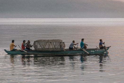 People Riding on Boat on Sea