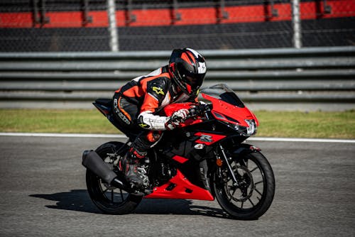 
Man Riding Motorcycle on Race Track