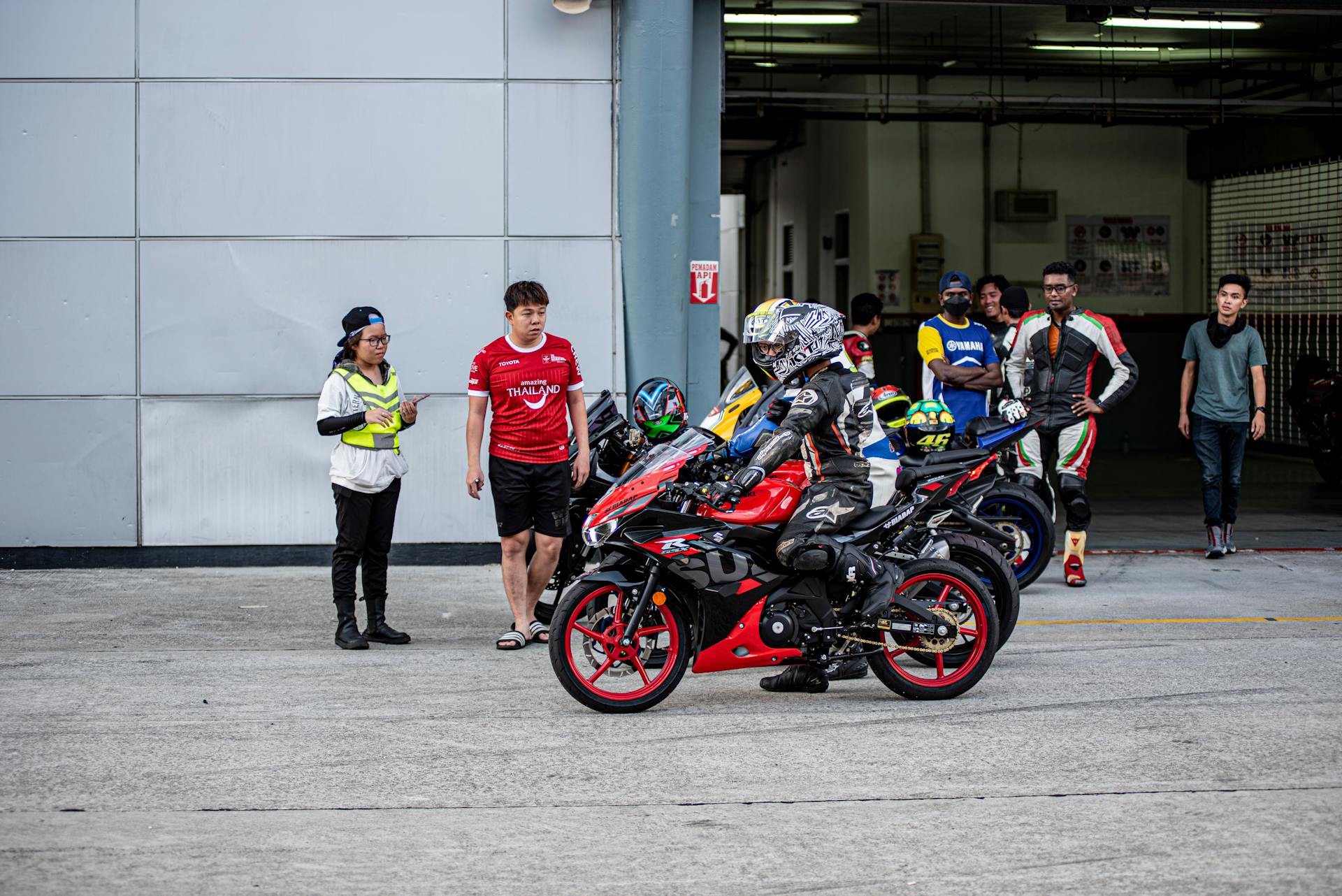 People in Full Safety Gear Riding on Motorcycles