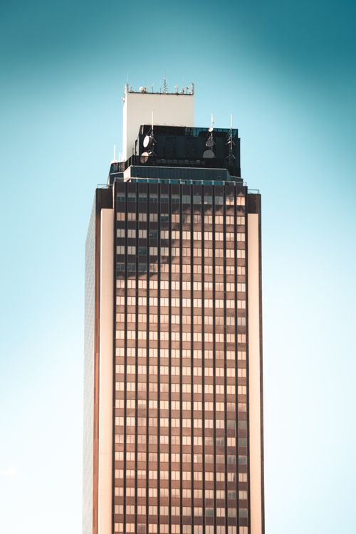 Free Tall skyscraper in Nantes, France with a clear blue sky backdrop. Stock Photo