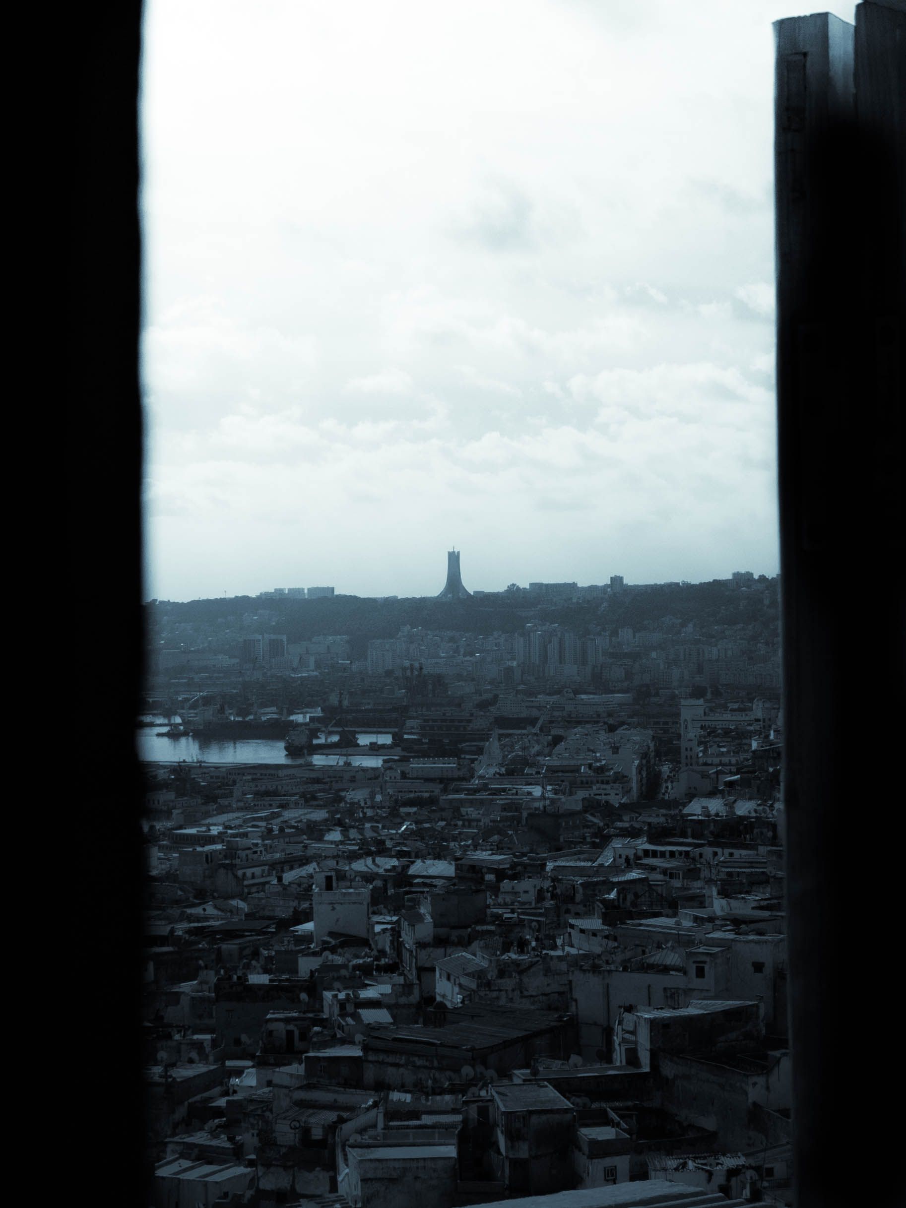 Aerial View of a City under a Cloudy Sky · Free Stock Photo