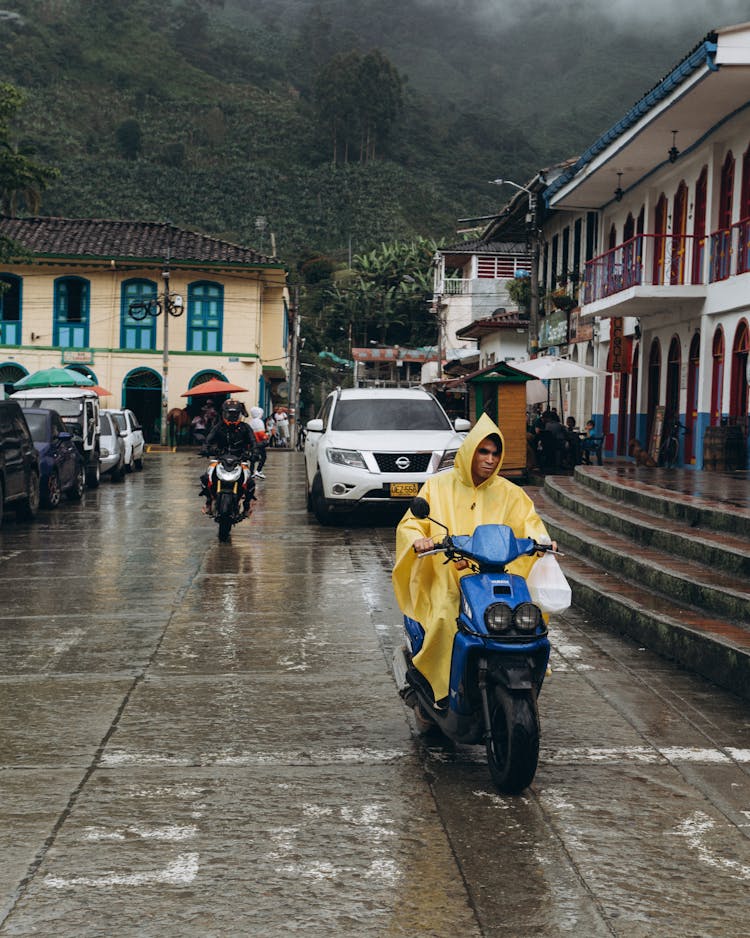 People Riding Motorcycles On The Road