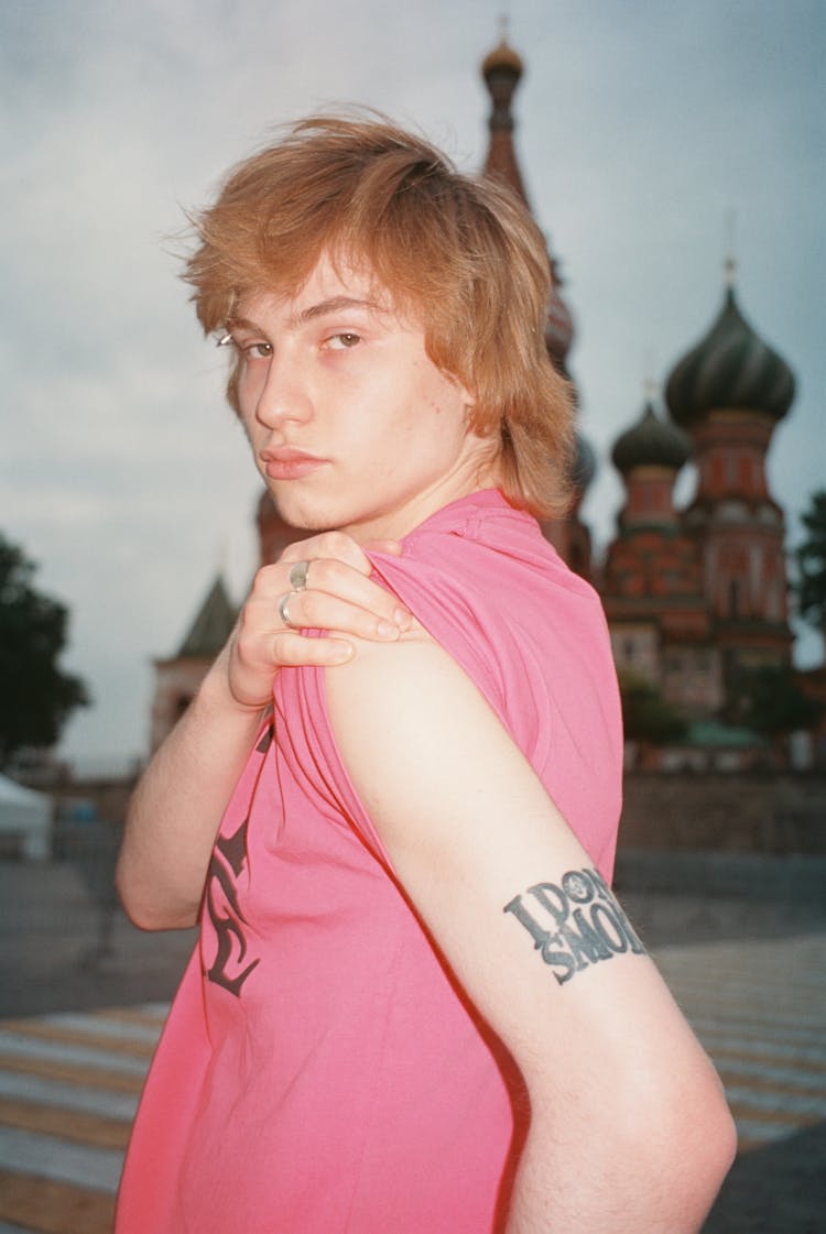 Blond Hair Man Showing His Tattoo