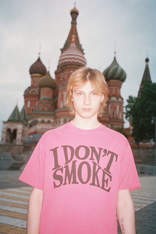 A Portrait of a Young Man near the Saint Basil's Cathedral