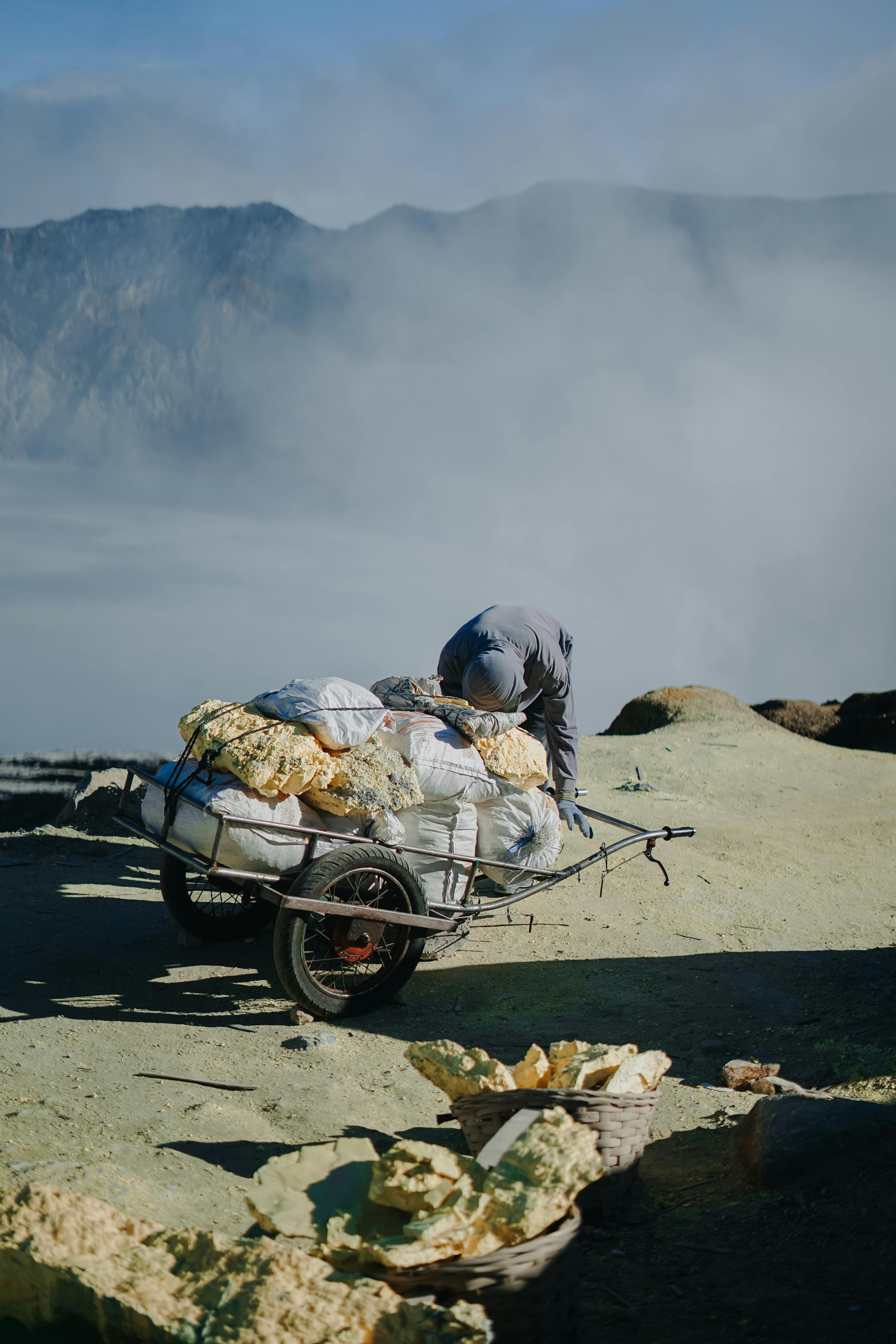 man with bags on trailer