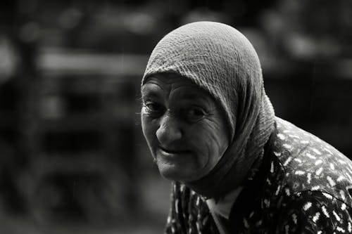 Grayscale Photo of an Elderly Woman