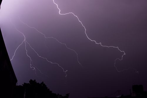 Free Dramatic lightning streaks illuminate the night sky during a long exposure shot. Stock Photo