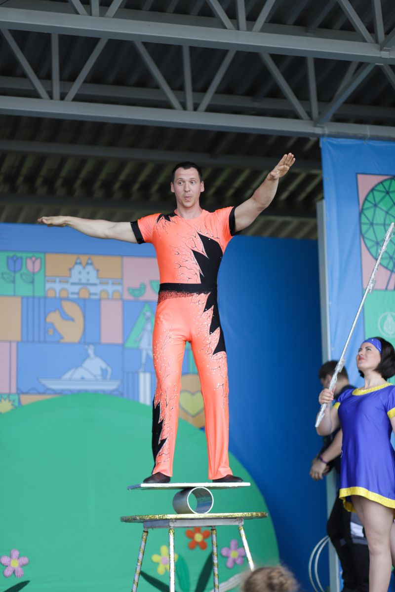 Circus performer balancing on a unicycle