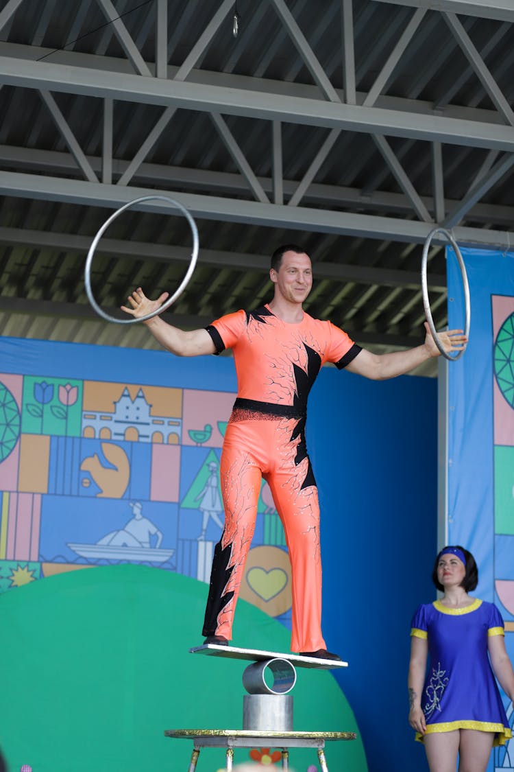 Performer Balancing And Spinning Circles