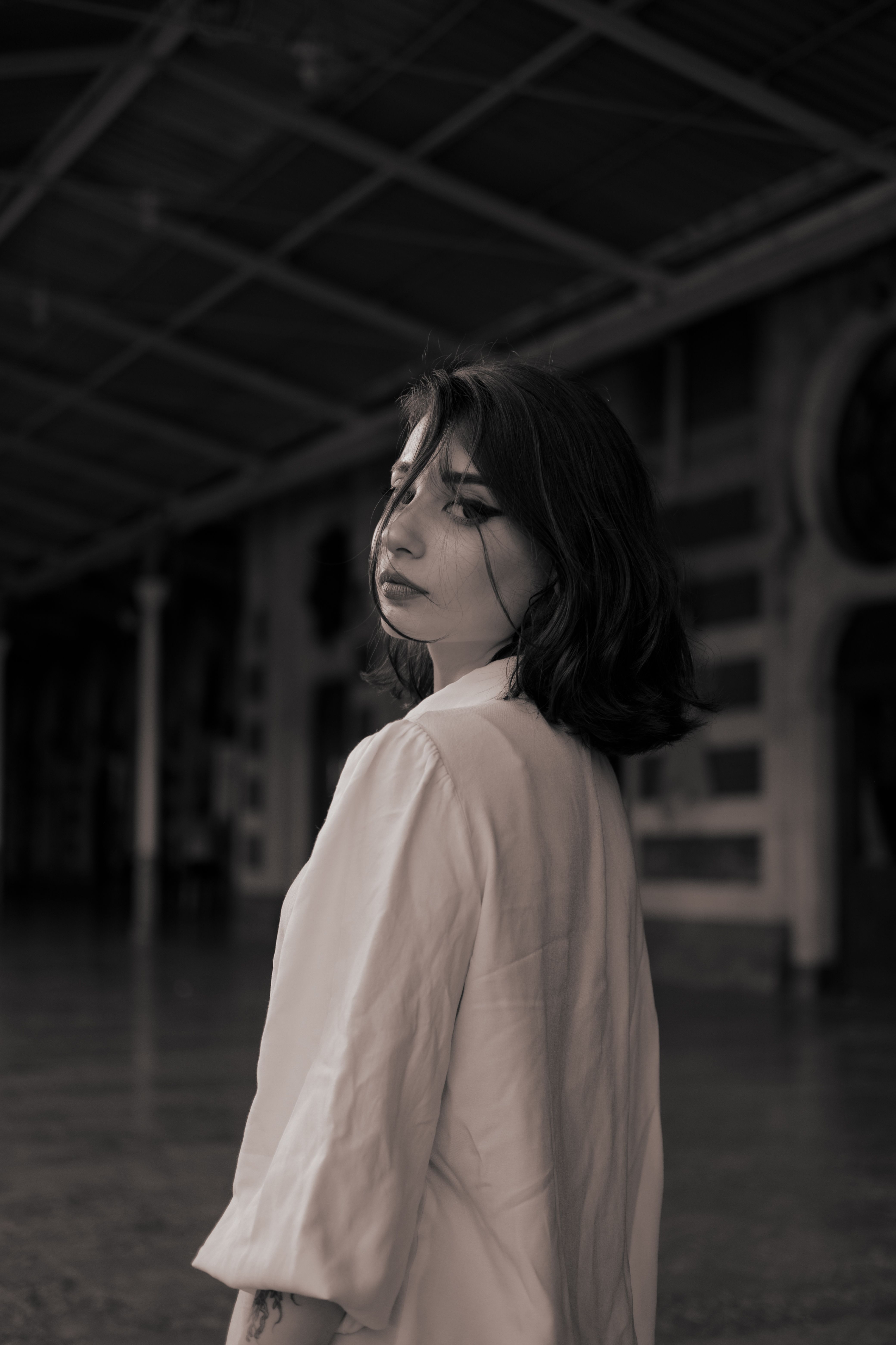 Grayscale Photo of a Woman in White Long Sleeves · Free Stock Photo