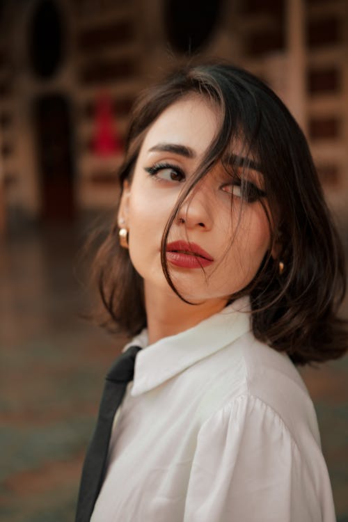 Close-Up Shot of a Beautiful Woman Looking Over Shoulder