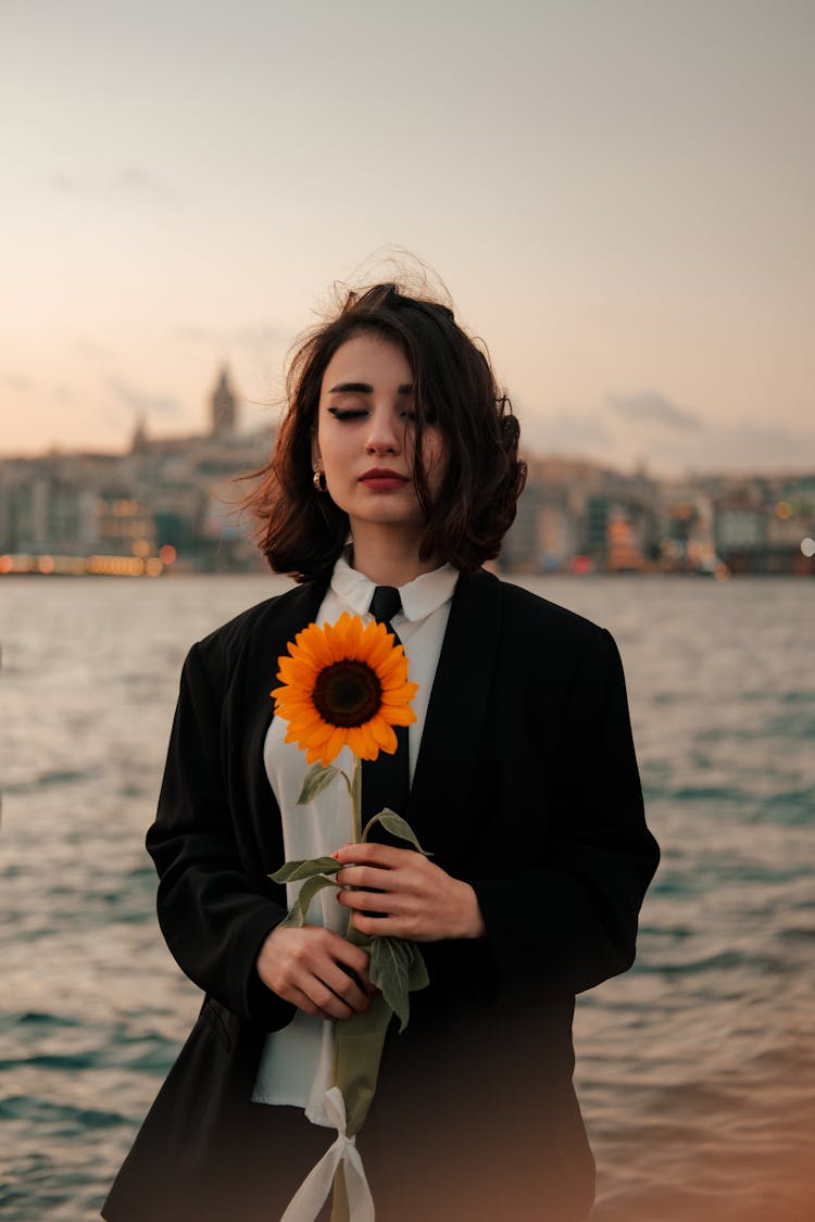 Woman Holding A Sunflower