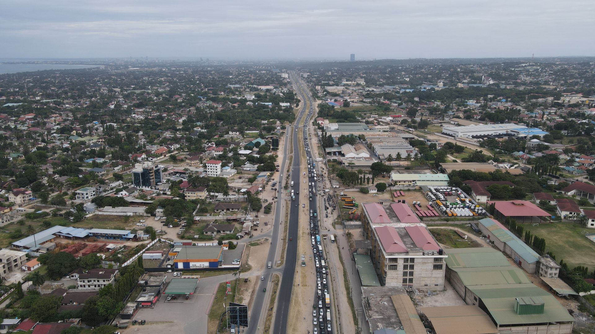 Aerial view showcasing the bustling urban landscape and city road in Tanzania.
