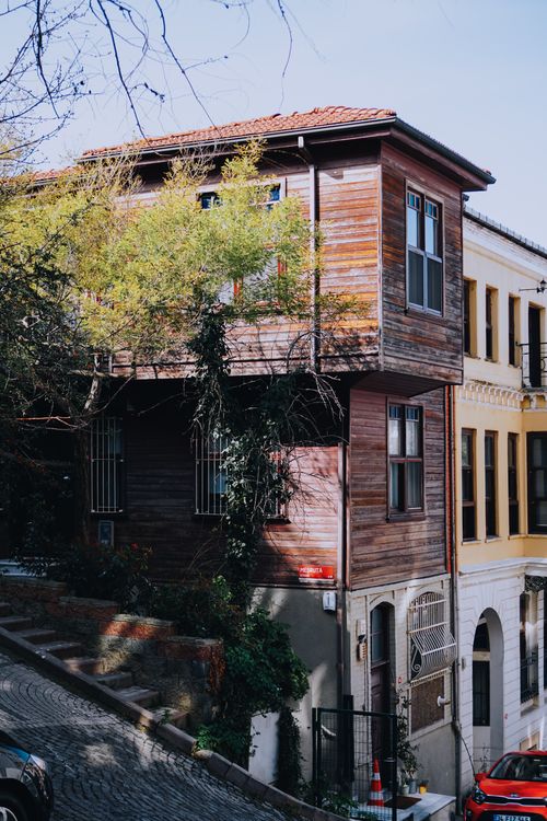 Free Charming wooden house in İstanbul showcasing traditional architecture on a narrow street. Stock Photo