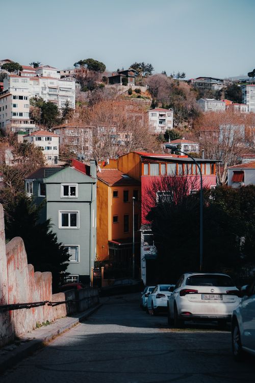 Free Vibrant residential street in Istanbul with colorful houses and parked cars. Stock Photo