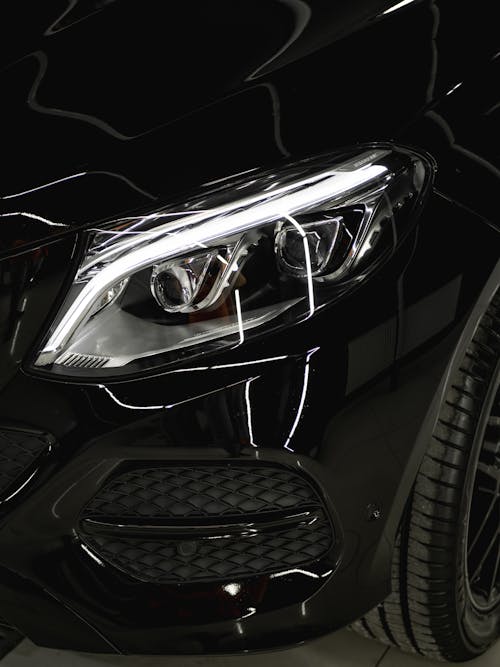 Free Close-Up Shot of a Black Car Headlight Stock Photo