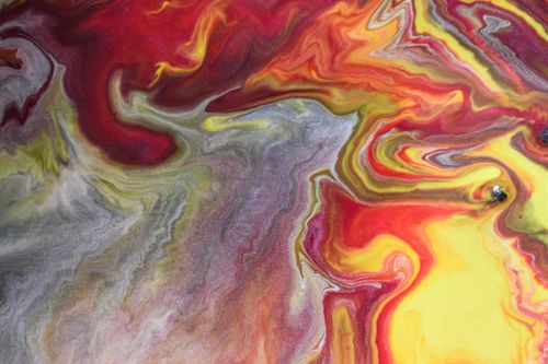 Free Colorful abstract pattern with swirling acrylic paints in vibrant shades. Stock Photo