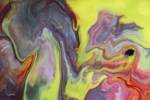 Exploring mesmerizing swirls in a close-up view of abstract fluid art with bold, vibrant hues.