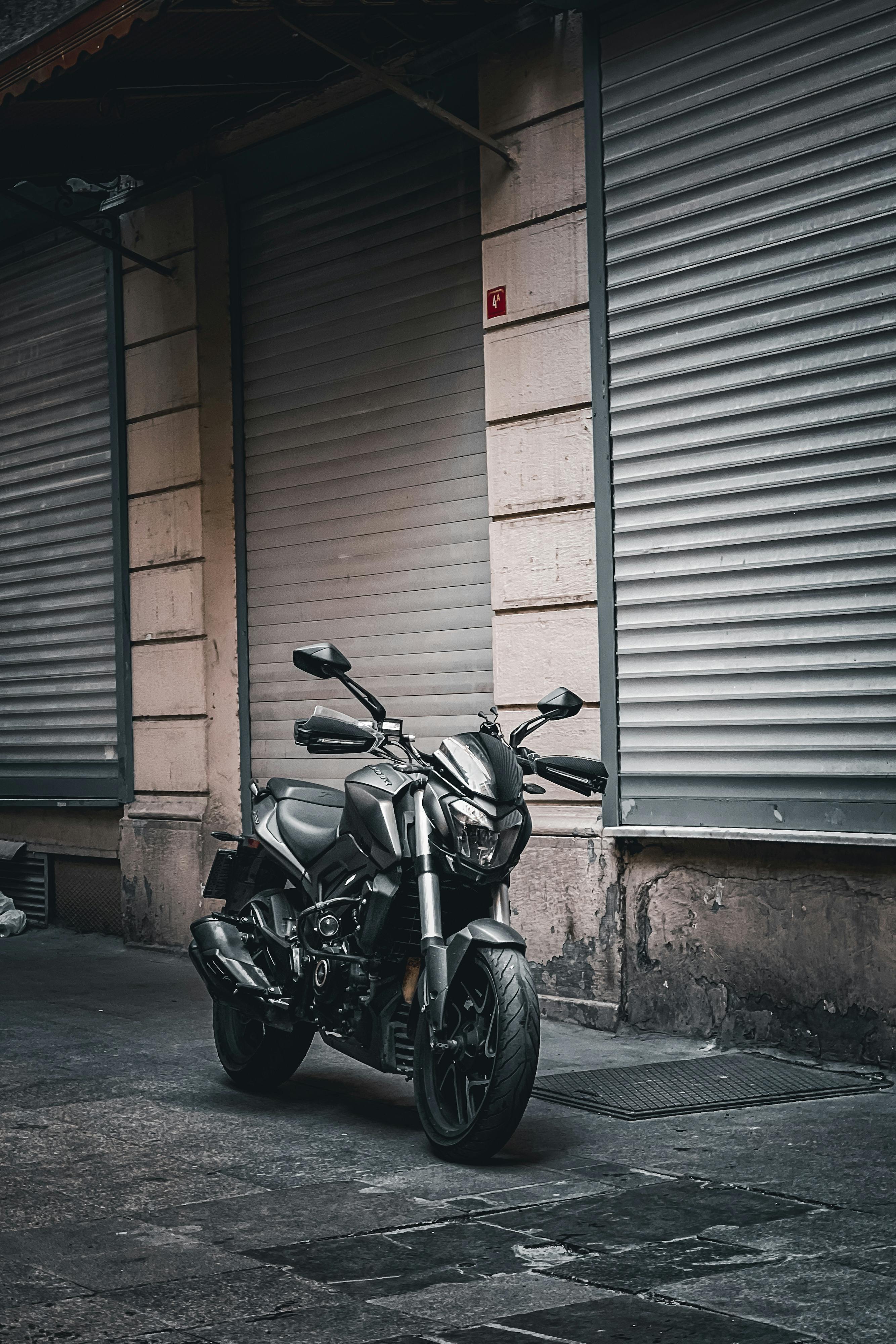 Black Motorcycle Parked On The Sidewalk · Free Stock Photo