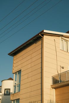 Contemporary house exterior showcasing clean lines and glass elements in Edremit, Turkey.