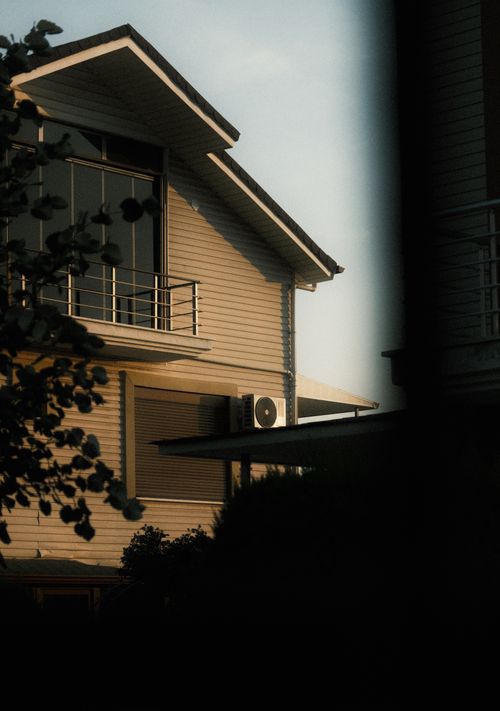 Free A close-up view of a modern house facade with sleek architectural lines and natural light. Stock Photo