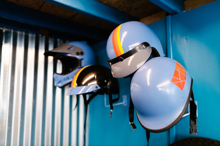 Vintage Blue Helmets Handing On A Blue Wall 