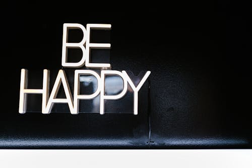 Free Neon Sign Saying Be Happy  Stock Photo
