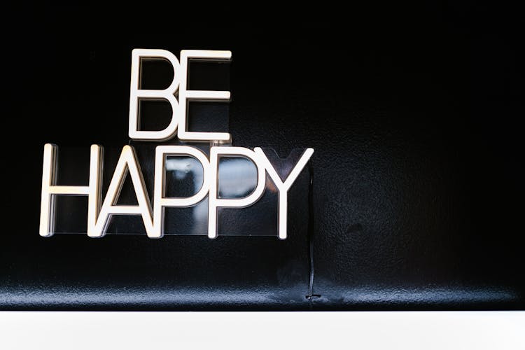 Neon Sign Saying Be Happy 