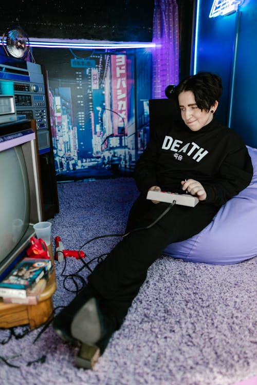 Young Man Using Game Console