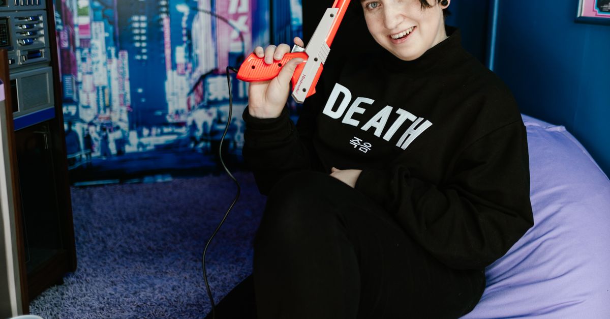 Young Man Using Game Console · Free Stock Photo