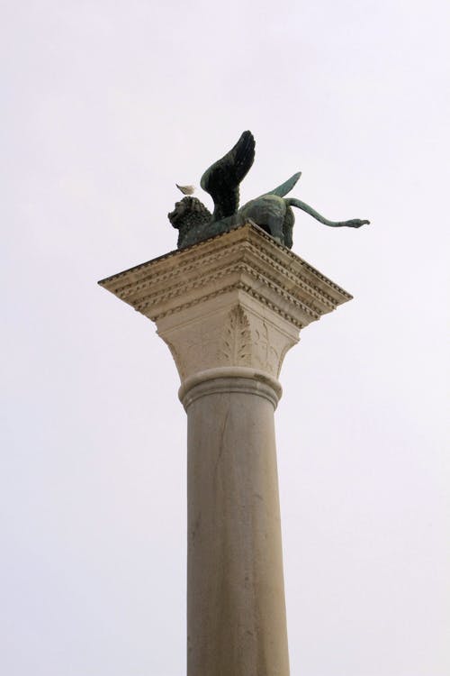 Bronze Winged Lion Sculpture on Top of a Column