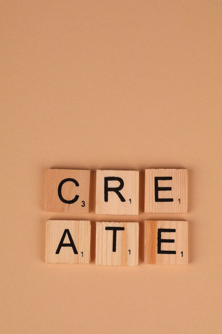 Wooden Scrabble Tiles On Brown Background