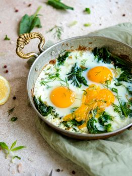 Delicious Menemen with fresh eggs and greens in a rustic pan, perfect for a healthy breakfast.