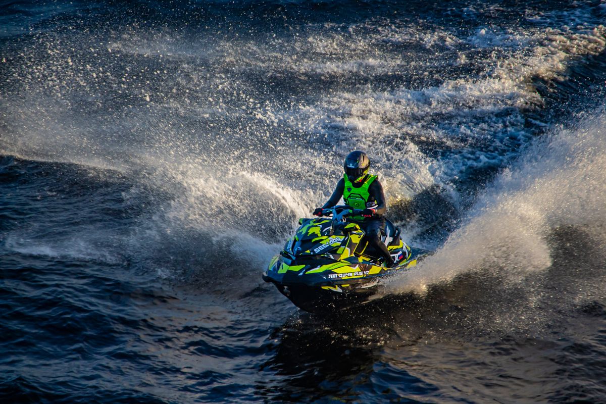 Performance jet ski cutting through ocean waves