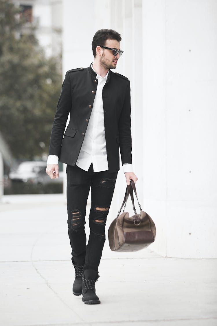 Stylish Man With Bag Walking On Street